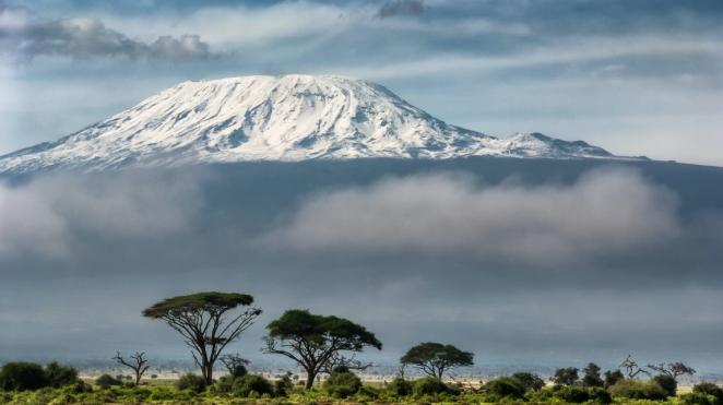 view of mount kilimanjaro through clouds wide