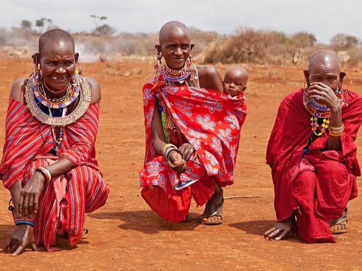 kenyan local masai mara tribesmen in the desert landscape