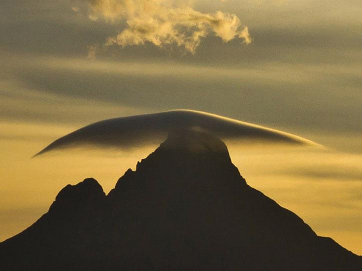 rwanda view of virunga volcanoes at sunset